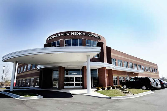 A large building with a sign on the front of it.